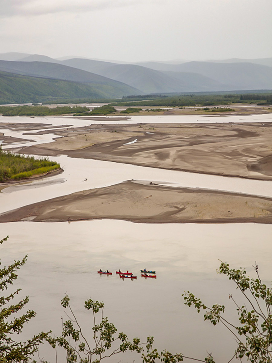 View of group canoeing in Yukon River from high above
