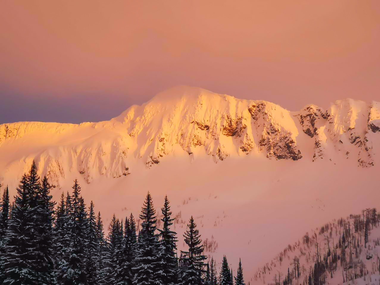 Sunset over snowy BC mountains