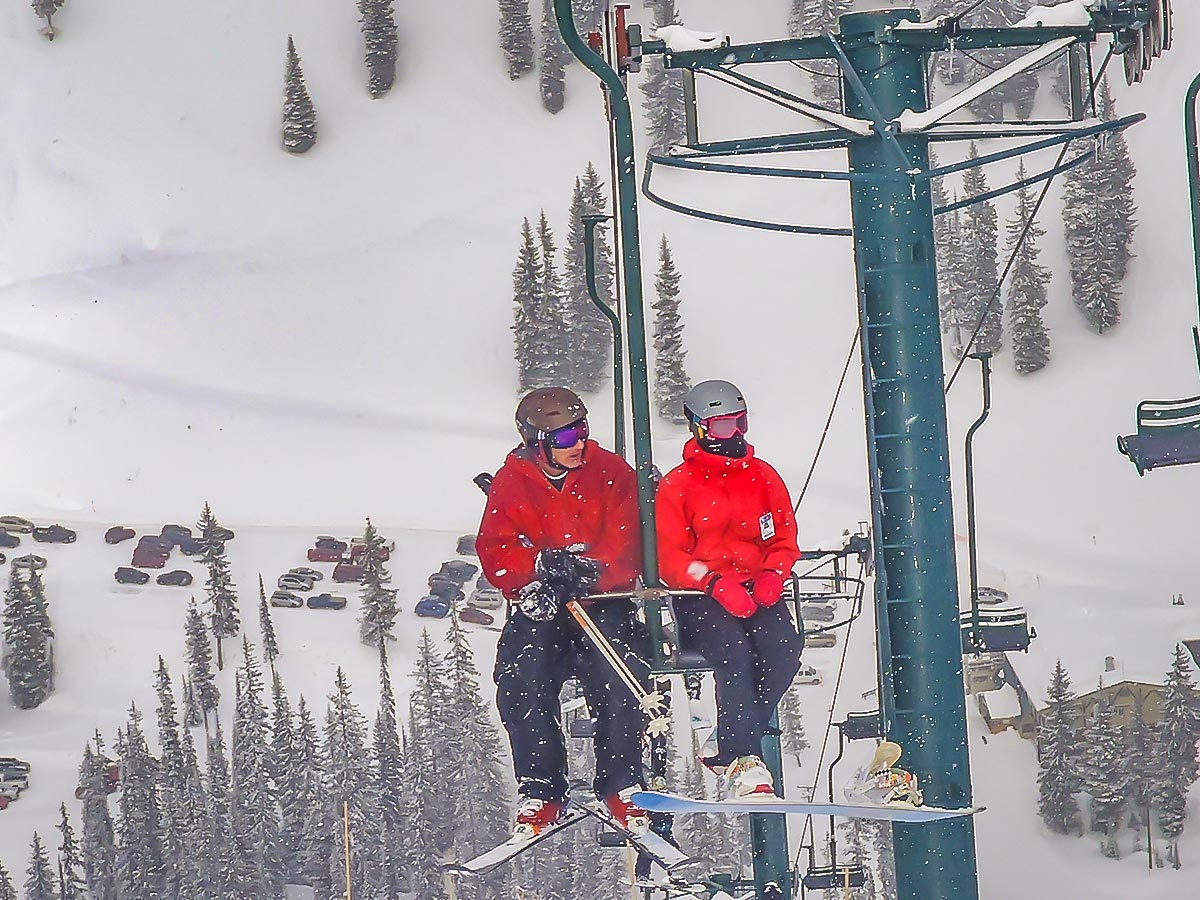 Two skiers on ski lift