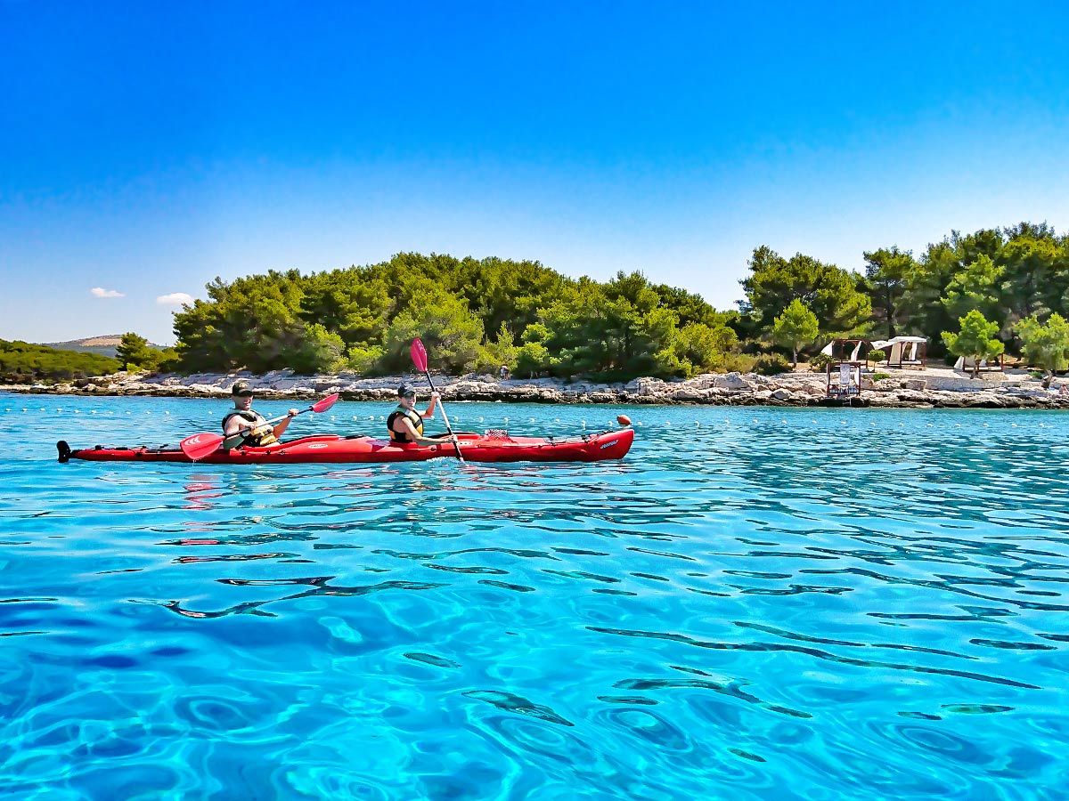 Red kayak near Pakleni Island on a guided tour to Croatian Islands