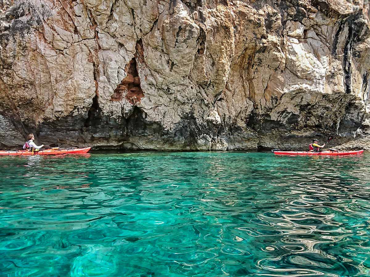 Kayakers paddling in the turquoise water of the Pakleni sea
