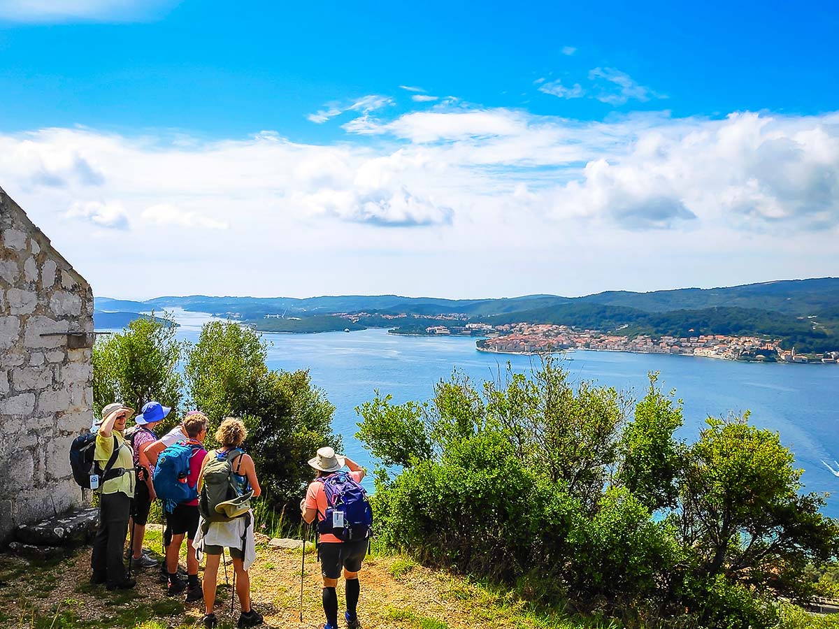 Group of hikers and stunning panoramic views of the Dalmatian Sea on a self guided hiking tour from Split