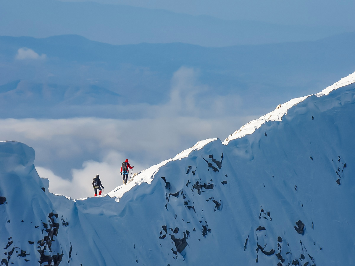 Snowshoeing along the mountain ridge in the Bulgarias mountains