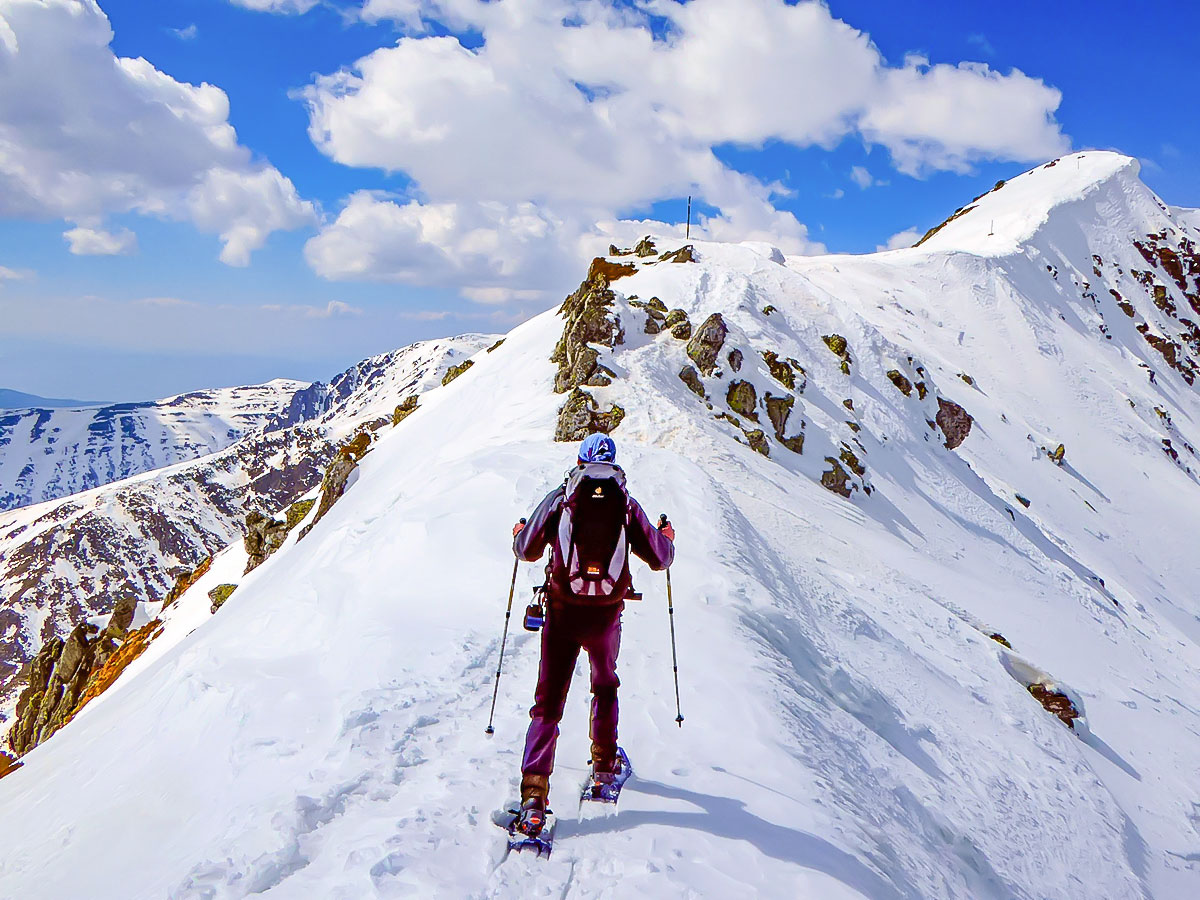 Snunning views from the Snowshoeing Tour in Bulgaria with a guide