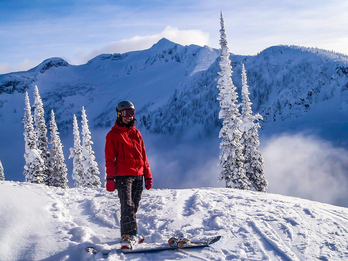 Skier posing on a mountain in the Canadian Rocky Mountains