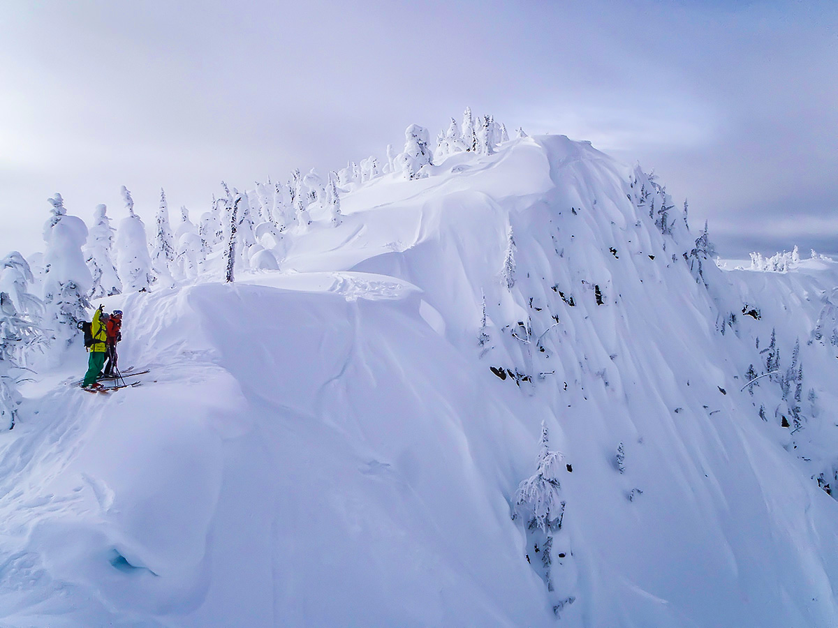 Two backcountry skiers admiring the views of the Canadian Rocky Mountains