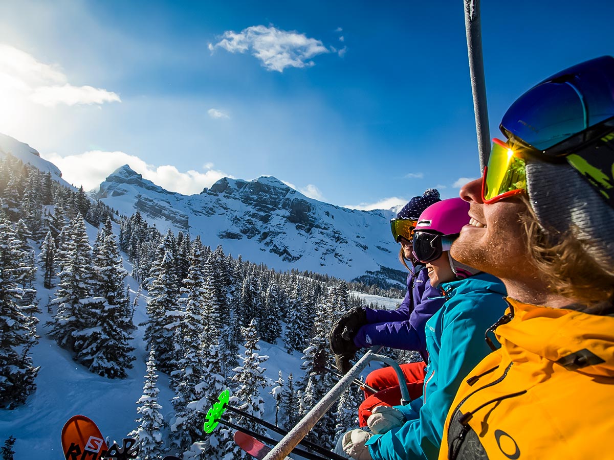 Skiers in Canadian backcountry on a guided ski tour