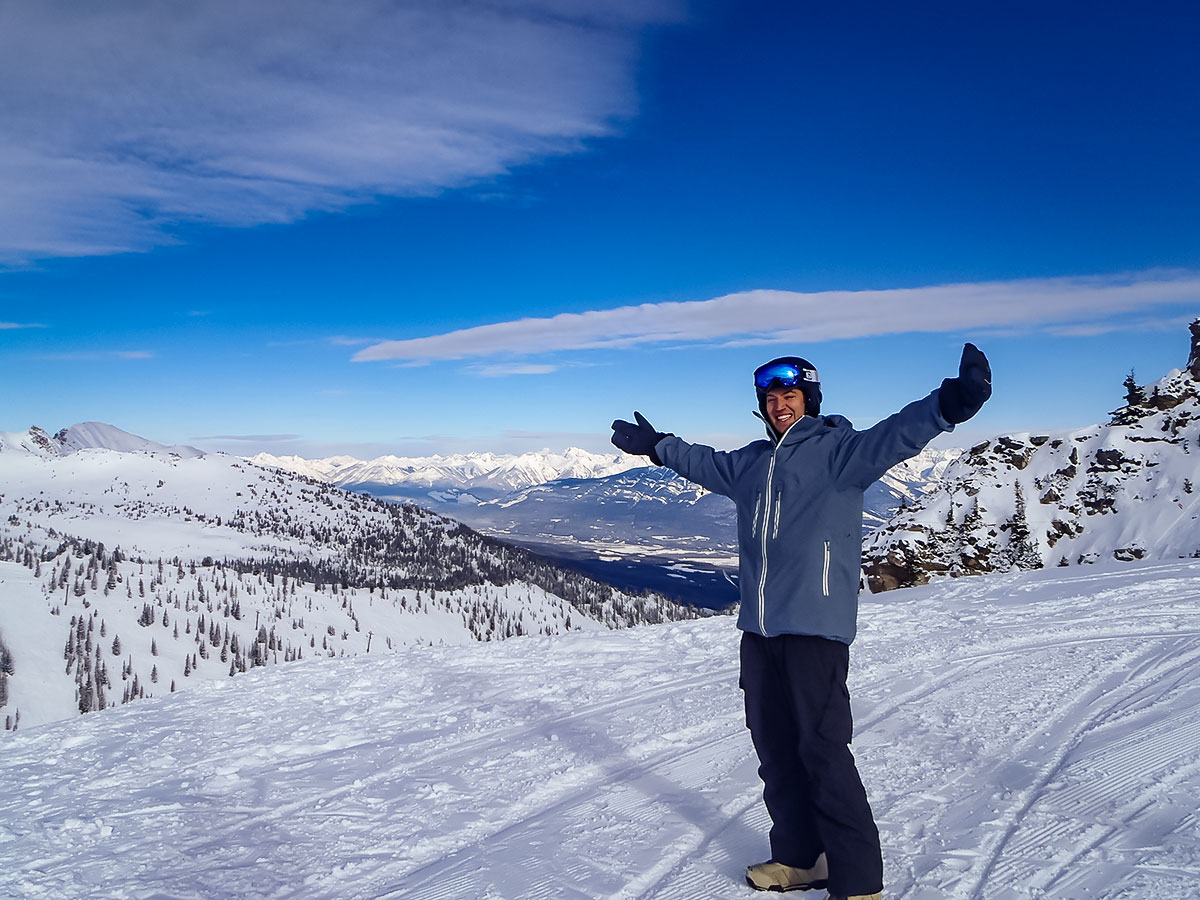 Skier posing on top of the mountain along the Powder Highway