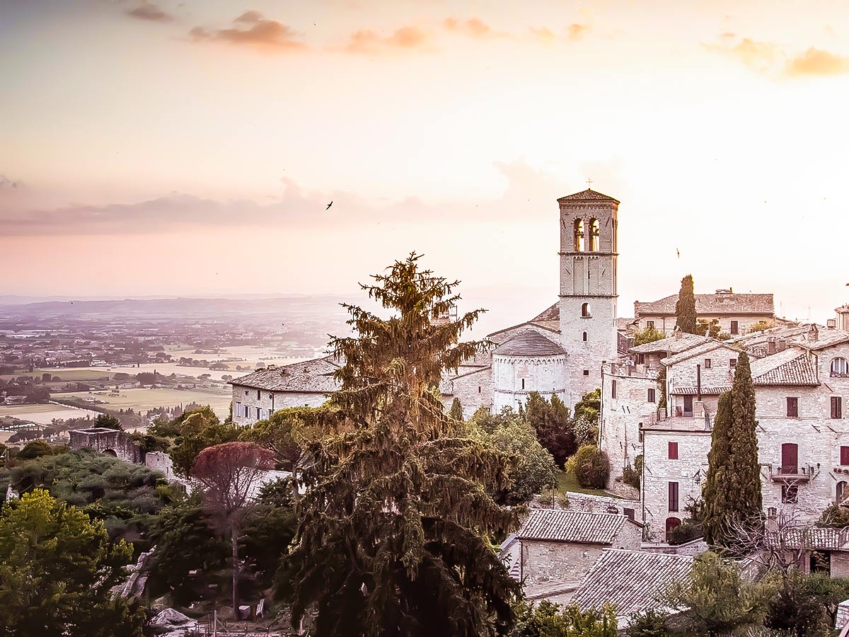 Sunset over Assisi seen on St Francis trek in Italy
