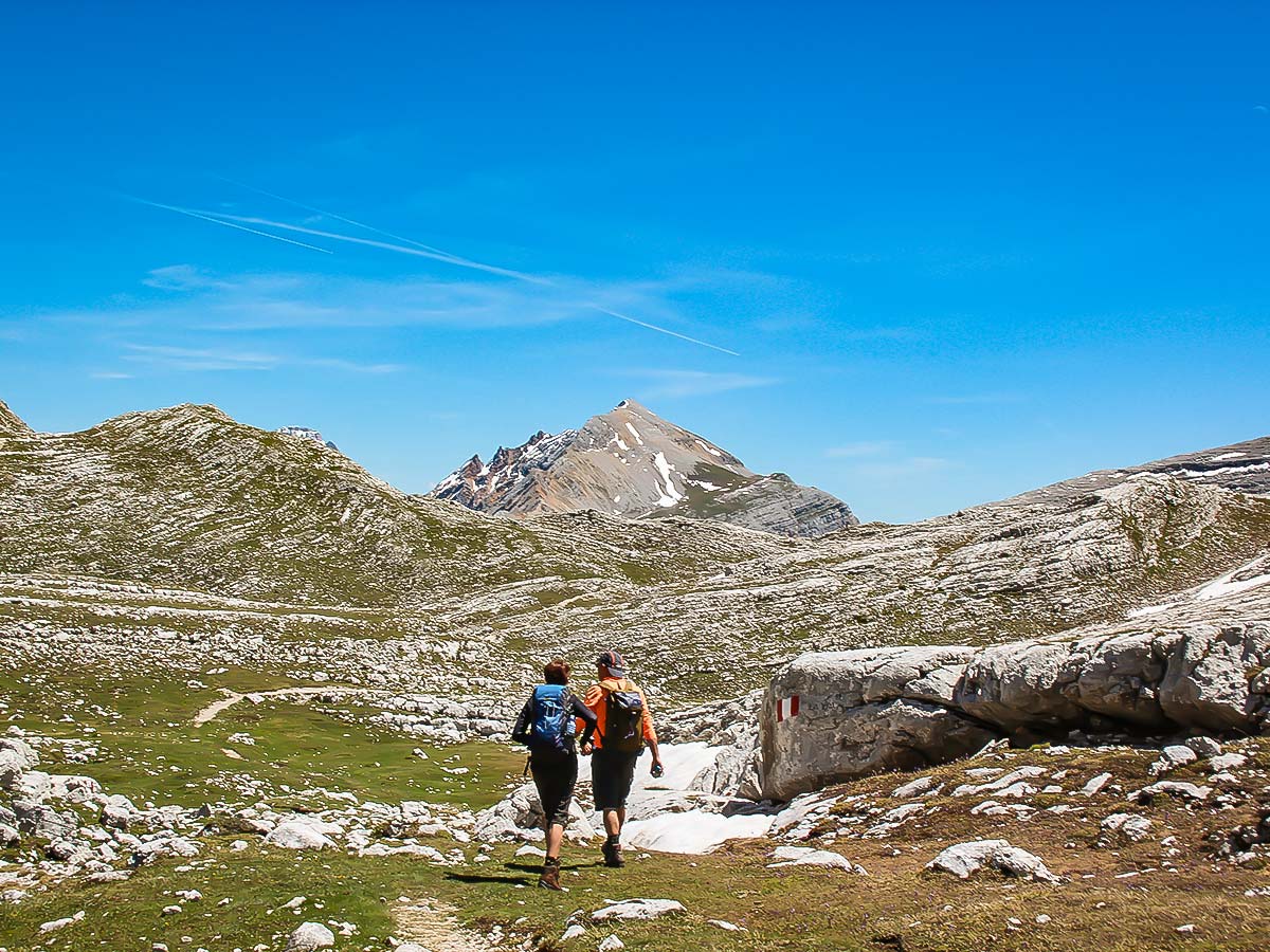 Two hikers enjoying the views on Self Guided Val Badia Trek