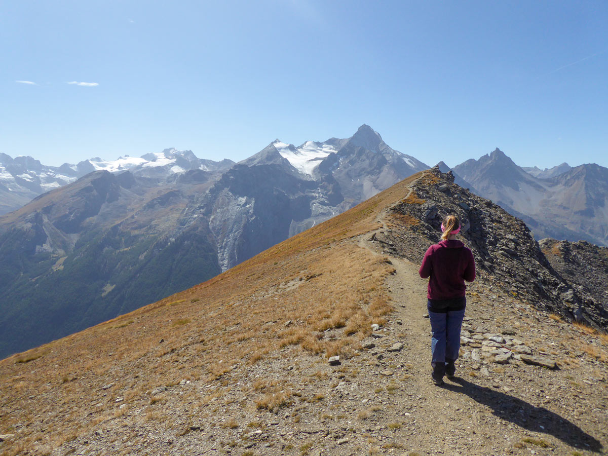 Hiker approaching the Col de Tza Seche peak in Cogne Valley Aosta Italy