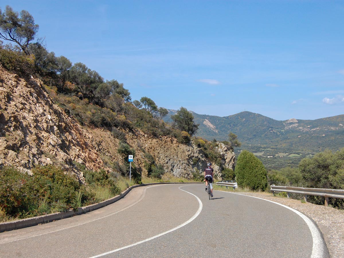 Biker cycling on self guided biking tour in Sardinia Italy
