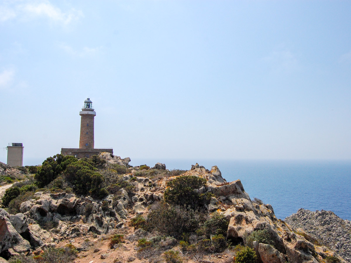 Lone lighthouse in Sardinia Island seen on self guided biking tour in Sardinia