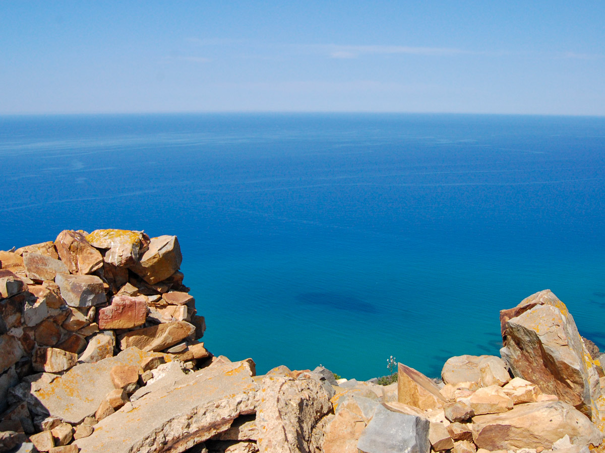 Looking down at Mediterranea Sea from the rocky shores of Sardinia Island