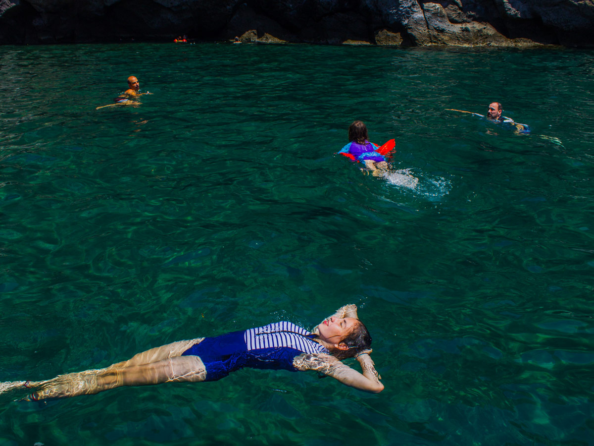 You can swim in blue Mediterranea Sea waters while on Ischia Family Tour