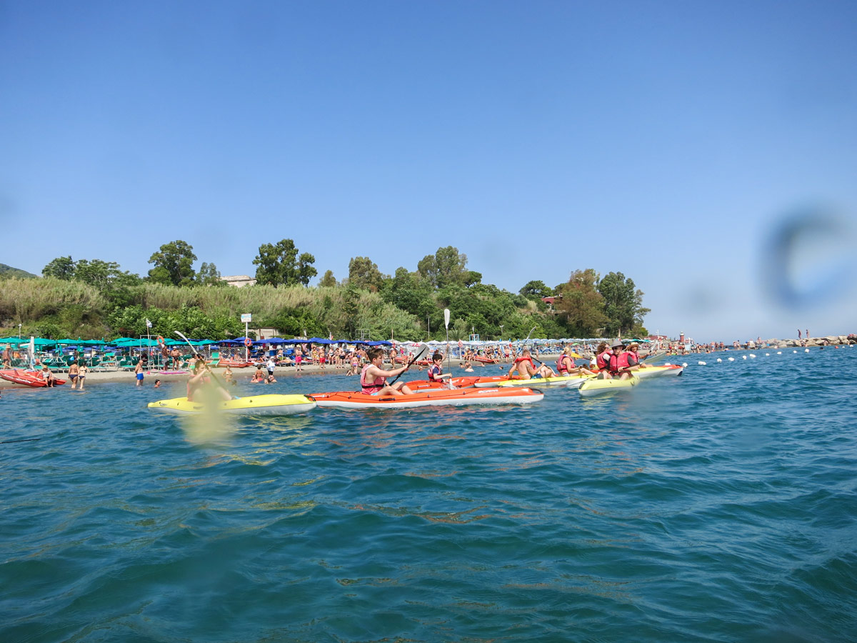 Kayaking in an open sea along the Naples coast in Italy