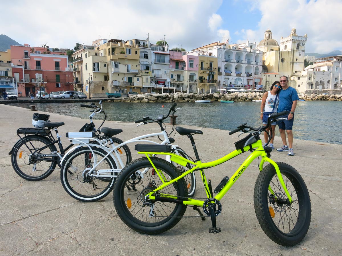 Ebikes lined up along the bay on Ischia and Capri Walking Tour in Italy