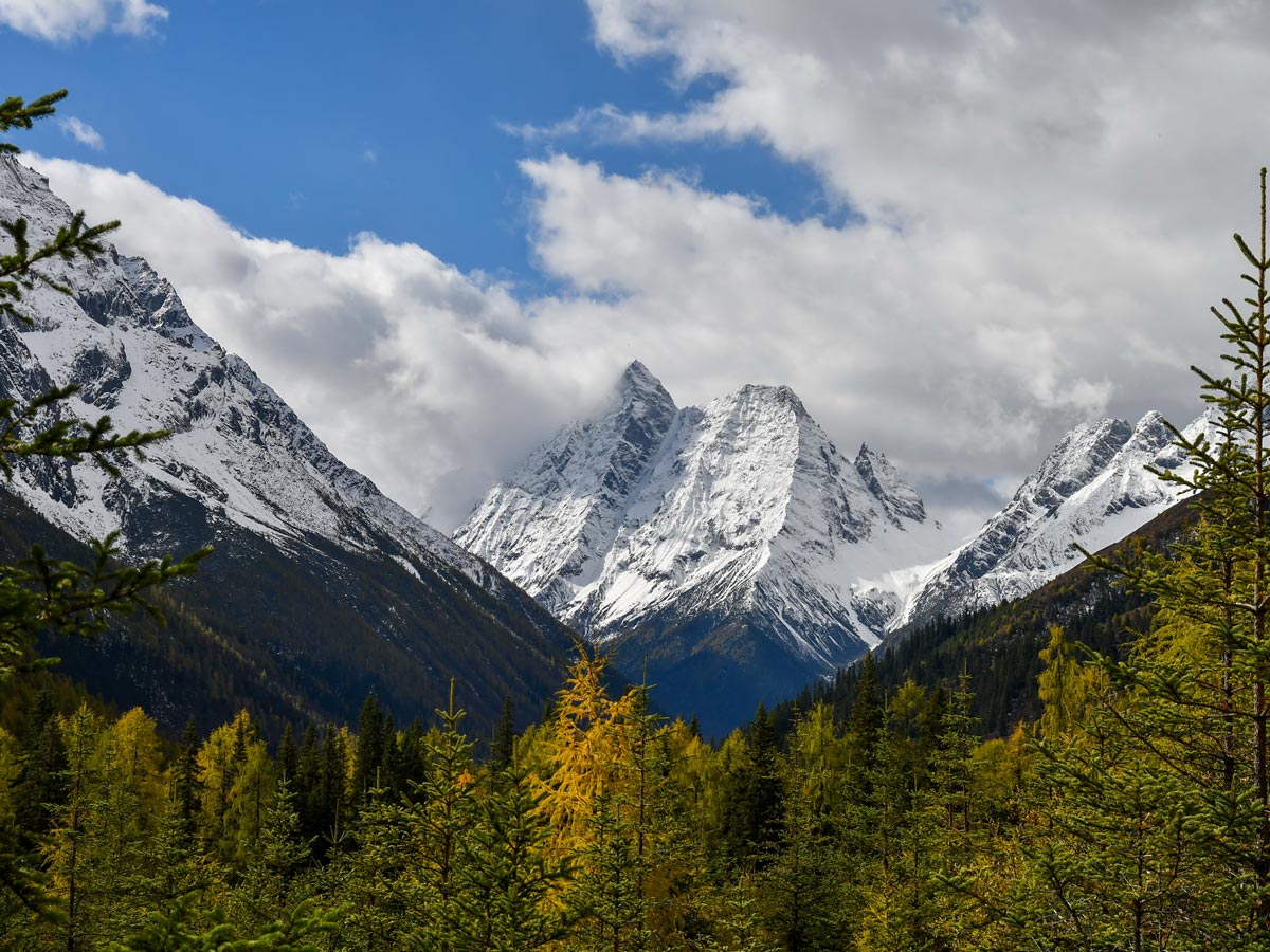 Shuangqiaogou of Siguniang Mountain high snowy mountain peaks seen while trekking in China