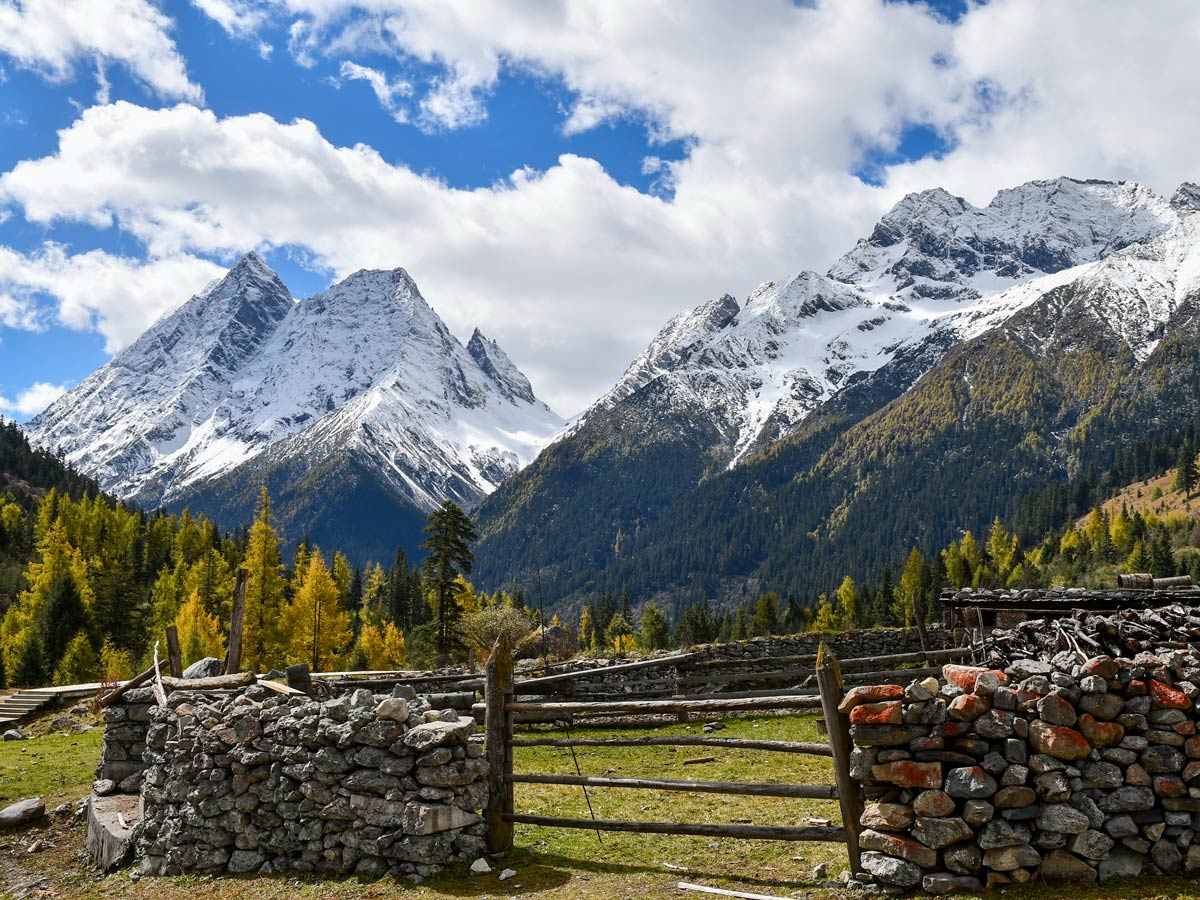 Shuangqiaogou of Siguniang Mountain and farmland seen while trekking in China