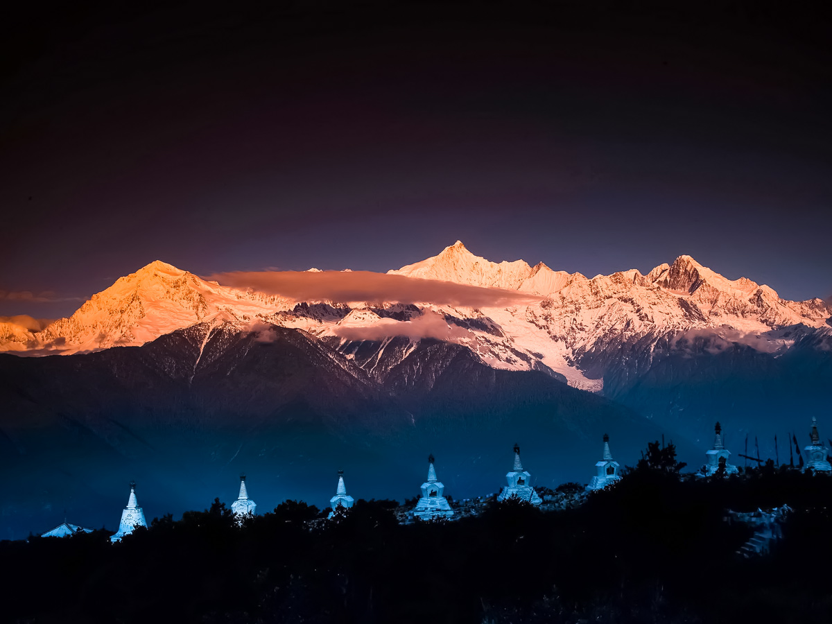 Meili Xueshan sunset over the mountains seen along trekking tour through China