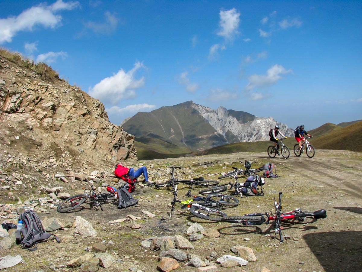 Bikers rest along road up Amnye Machen in Tibet