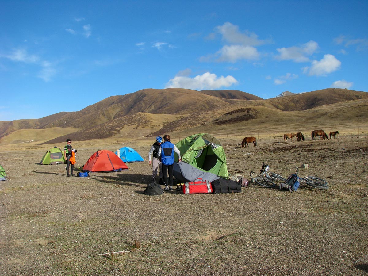Camping on biking trek to Amnye Machen Holy Mountain in Tibet