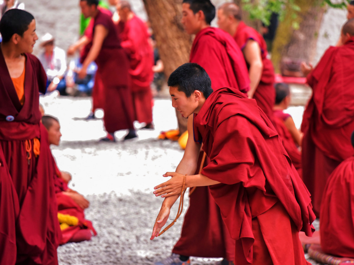 Buddhist Monks Debate in Sera along mountain biking tour in Tibet