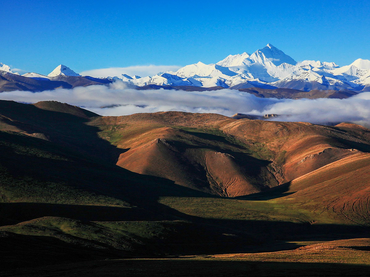 Mount Everest Himilayan mountain range seen along mountain biking tour in Tibet