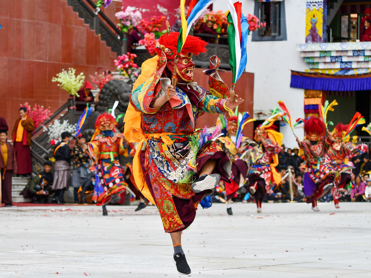 Traditional dancers at Katok Monastery Mask Dance Festival in West Sichuan