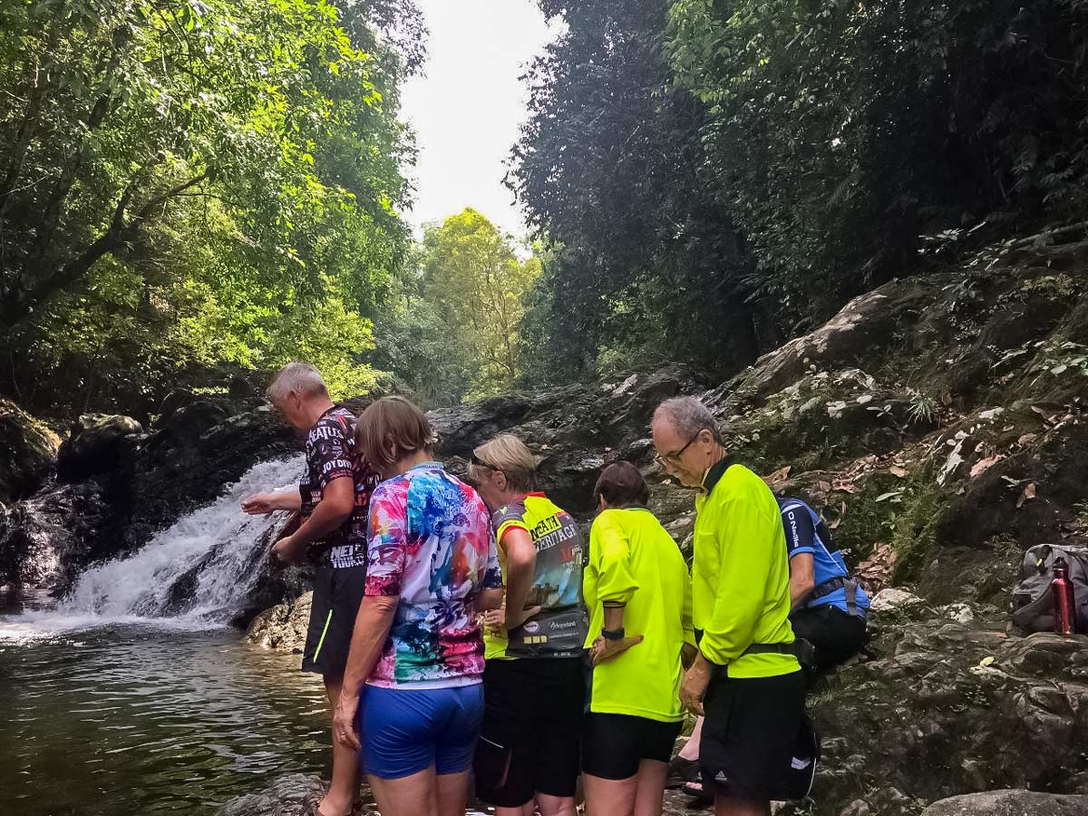Jungle cycling tour featureing natural waterfalls along Borneo Wildlife Bike Safari tour Malaysia