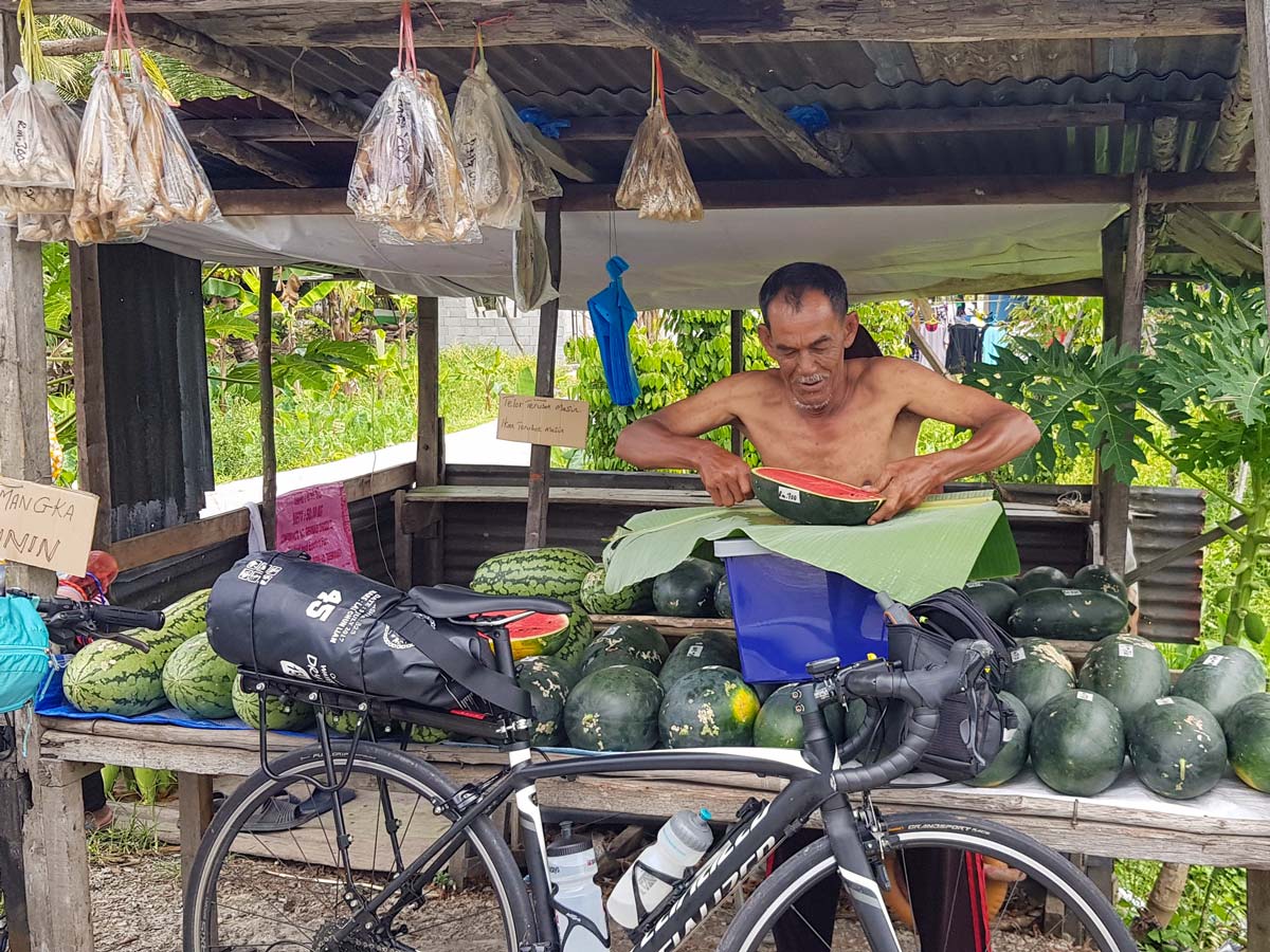 Fruit stand seen along Trans Borneo road bike tour Malaysia