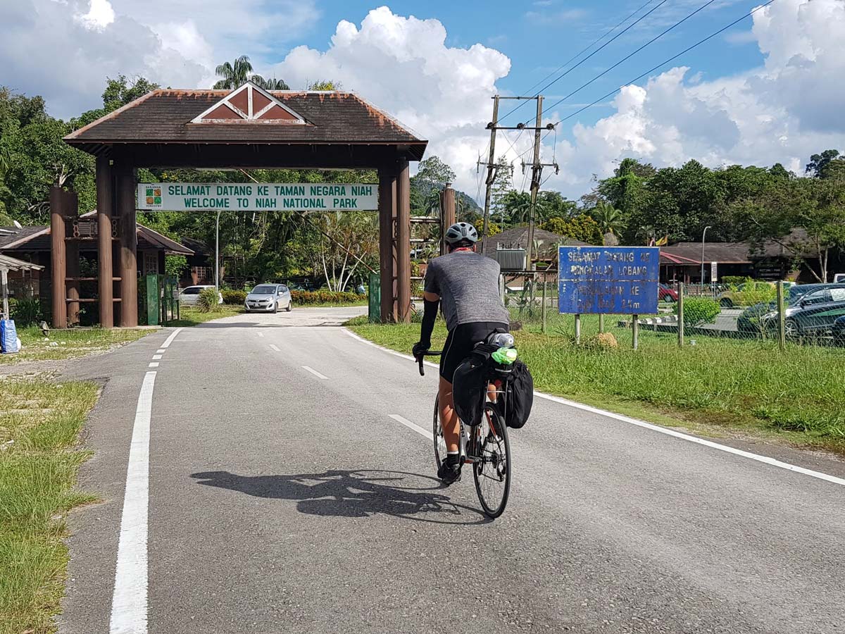 Biking through Niah National Park along Trans Borneo road bike tour Malaysia