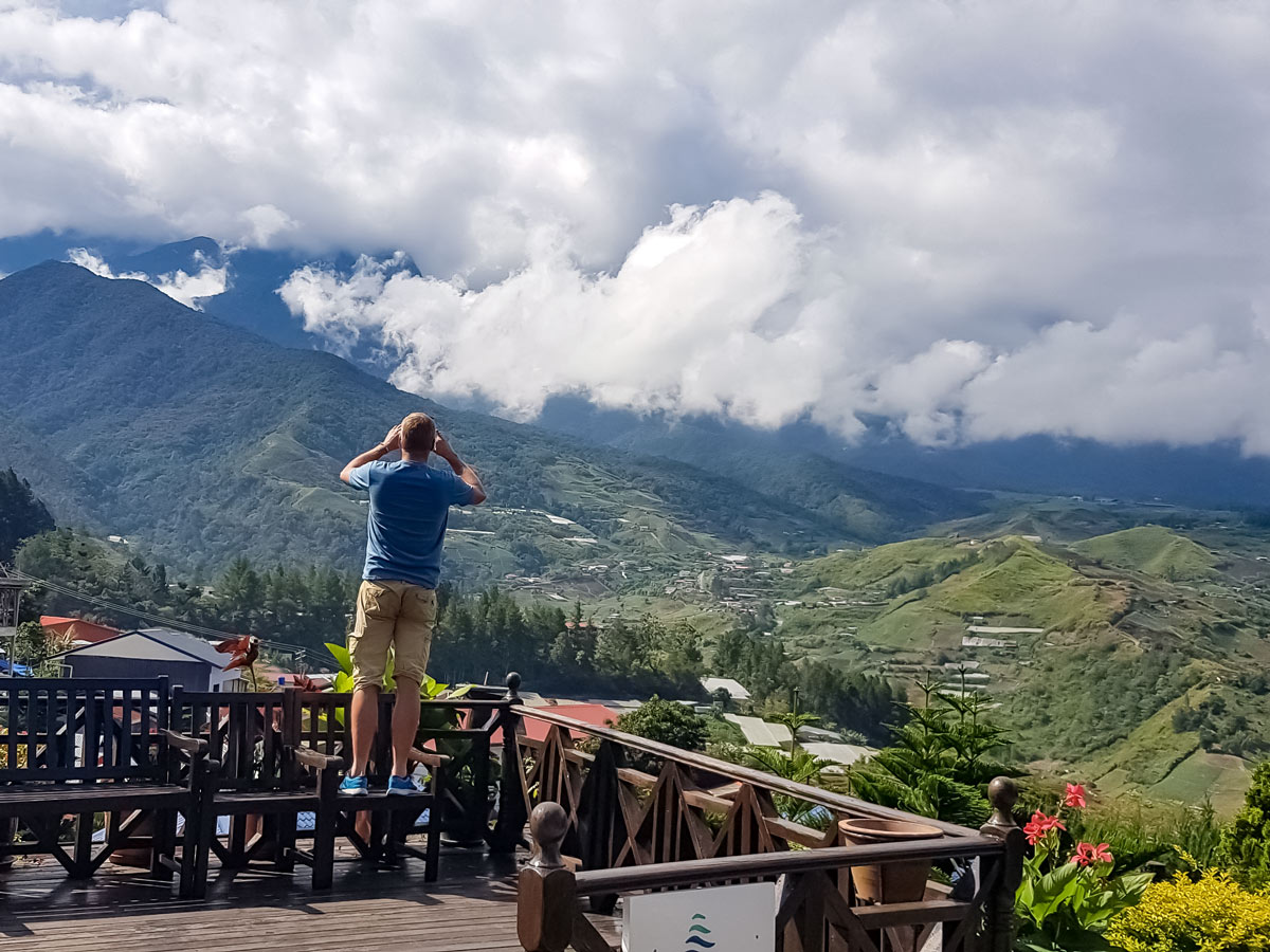 Cyclists admire the view along Trans Borneo road bike tour Malaysia