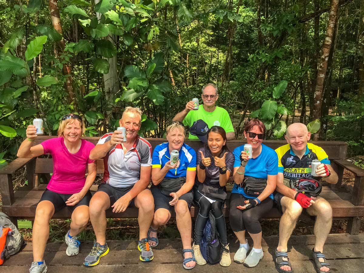 Cycling group cheers along Borneo Wildlife Bike Safari tour
