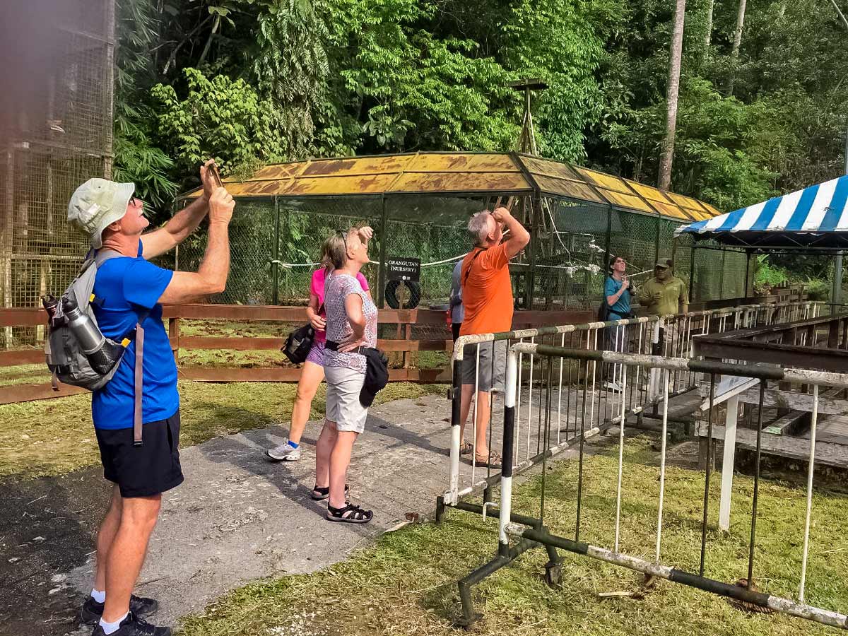 Cyclists view wildlife along Borneo Wildlife Bike Safari tour Malaysia