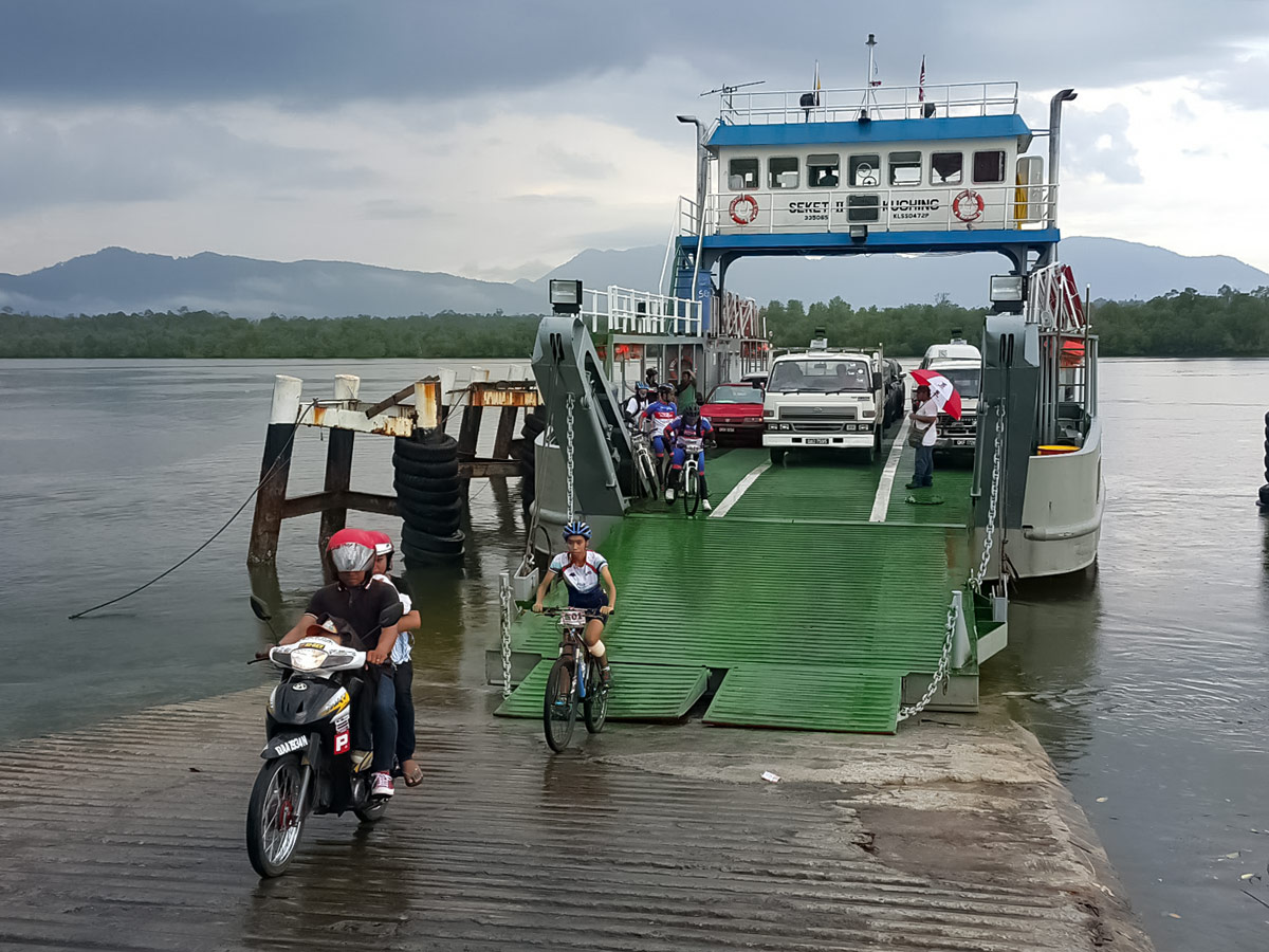 Cyclists exist ferry along Borneo Wildlife Bike Safari tour Malaysia