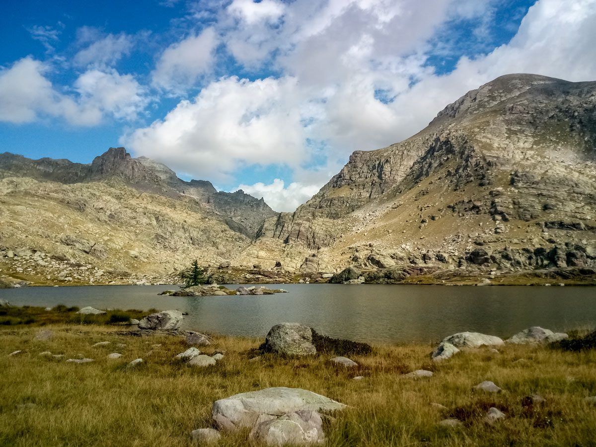 Mountain top lake seen hiking along Neolithic tour France