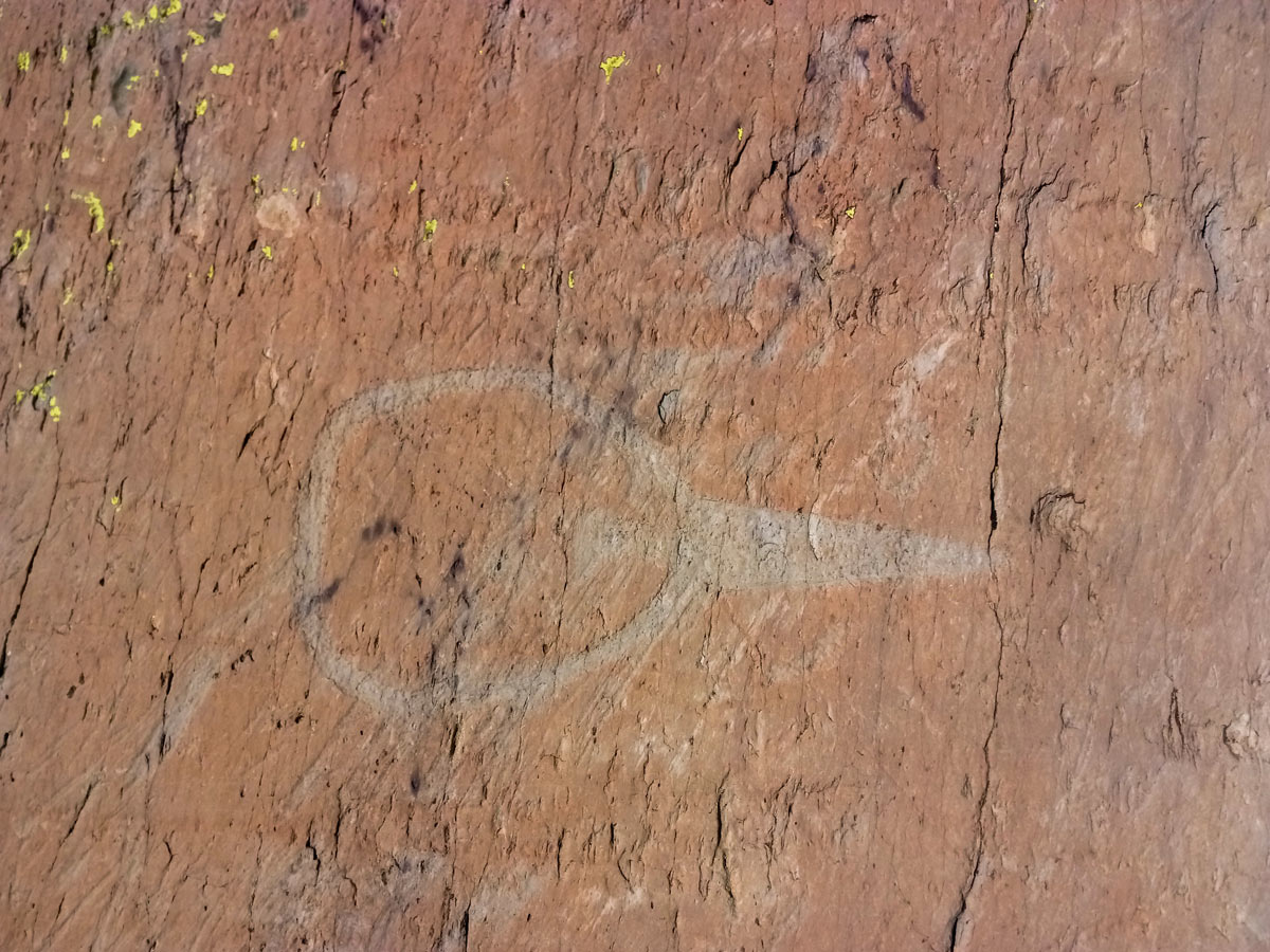 Carved images in the rock seen hiking along Neolithic tour France