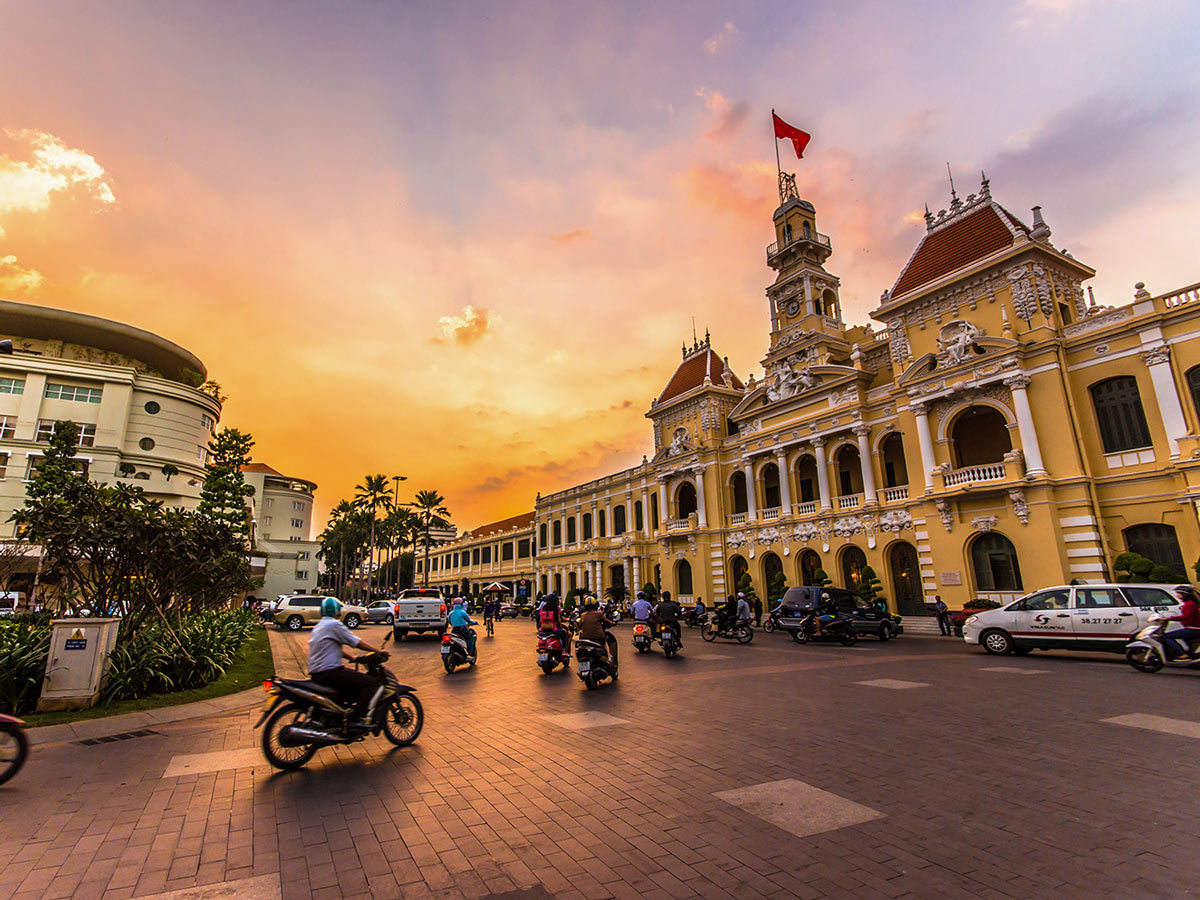 Traffic in front of Ho Chi Minh City Hall at twilight