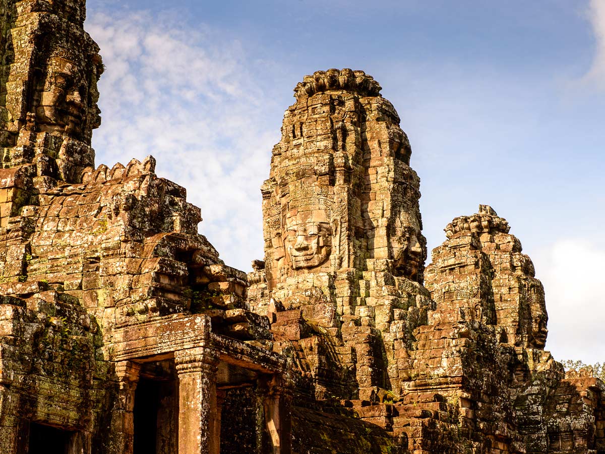 Part of Bayon Khmer temple at Angkor seen on cycling tour