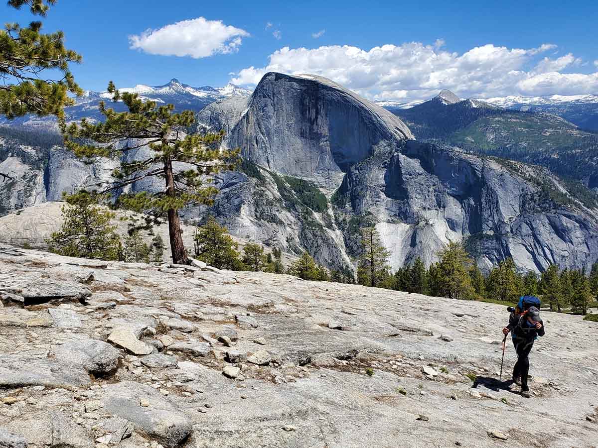 Hiker with Half Dome in the background