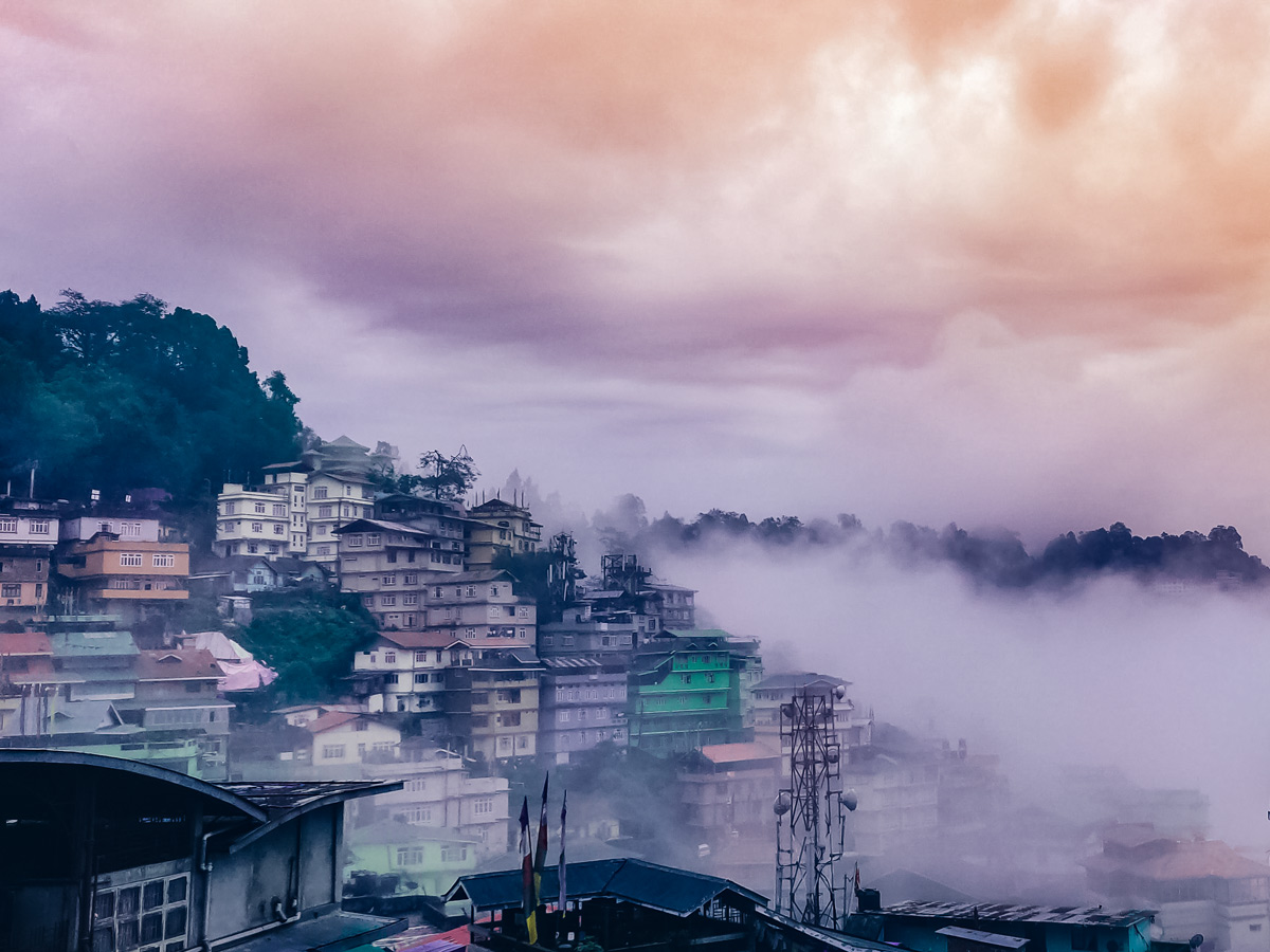 Beautiful rural Indian village in the fog hiking Goecha La Trek in India