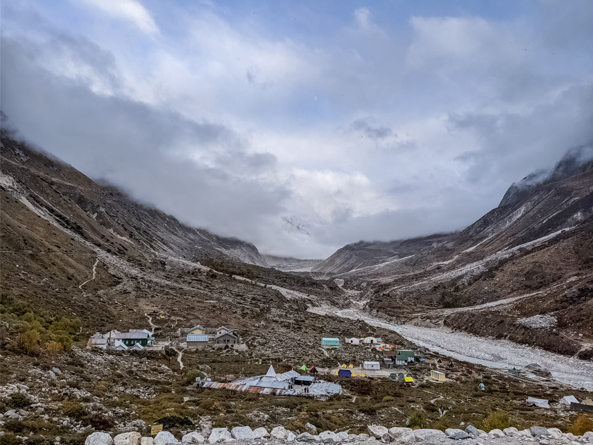 Looking down on beautiful village camp hiking Kalindi Khal Trek India