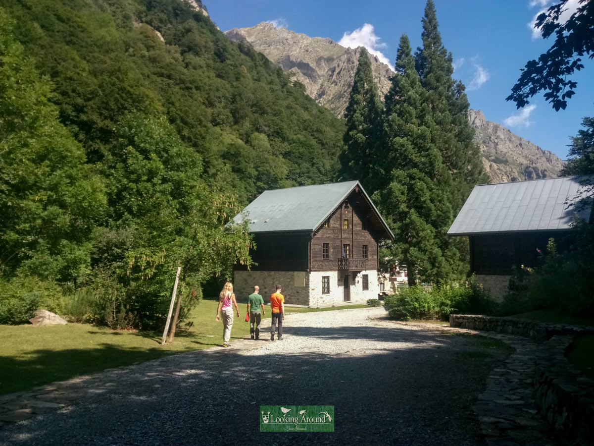 Hikers walk into village along Kings Path trekking in France