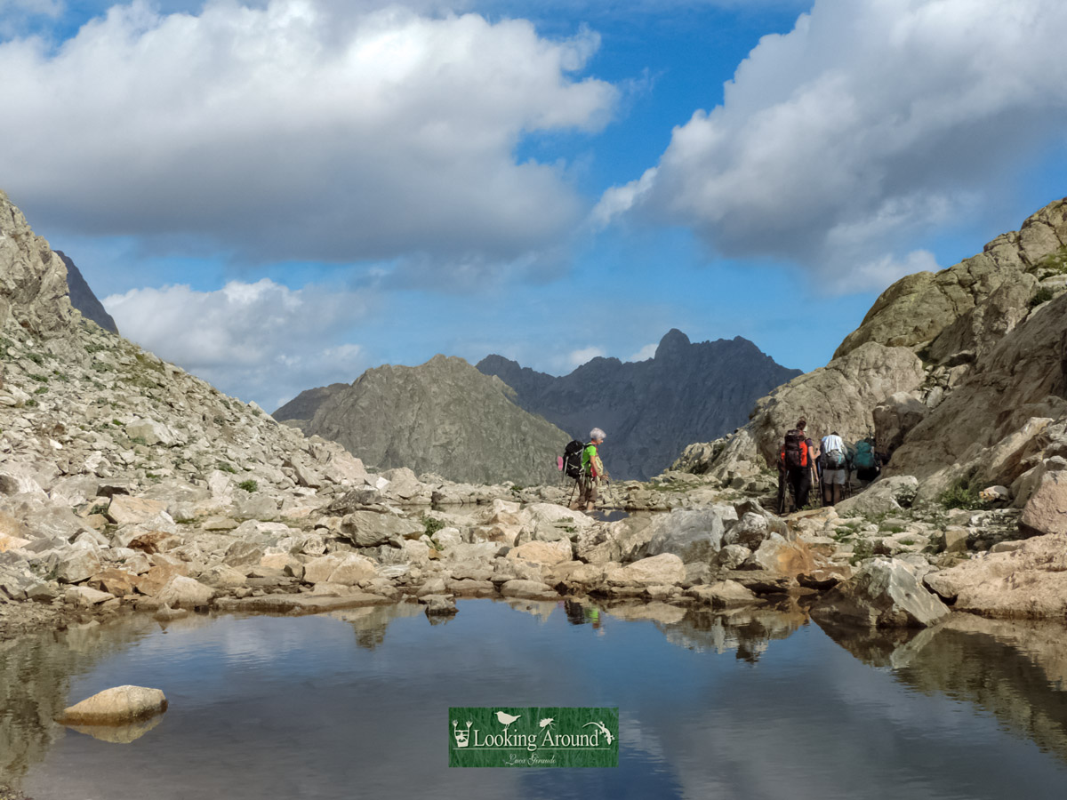 Hikers explore mountains lakes trekking Kings Path France