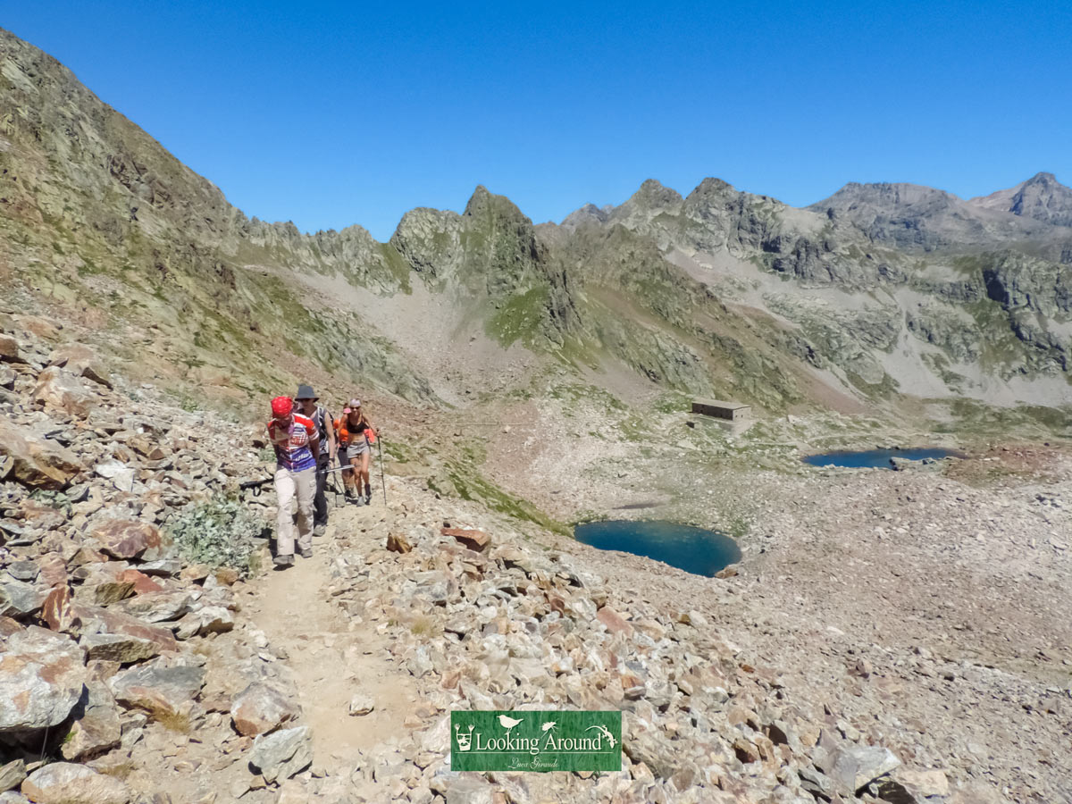 Hiking Kings Path trek around ridge and mountain lake in France