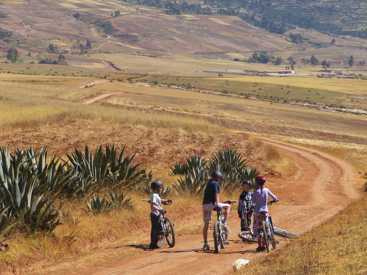 Family biking above Maras