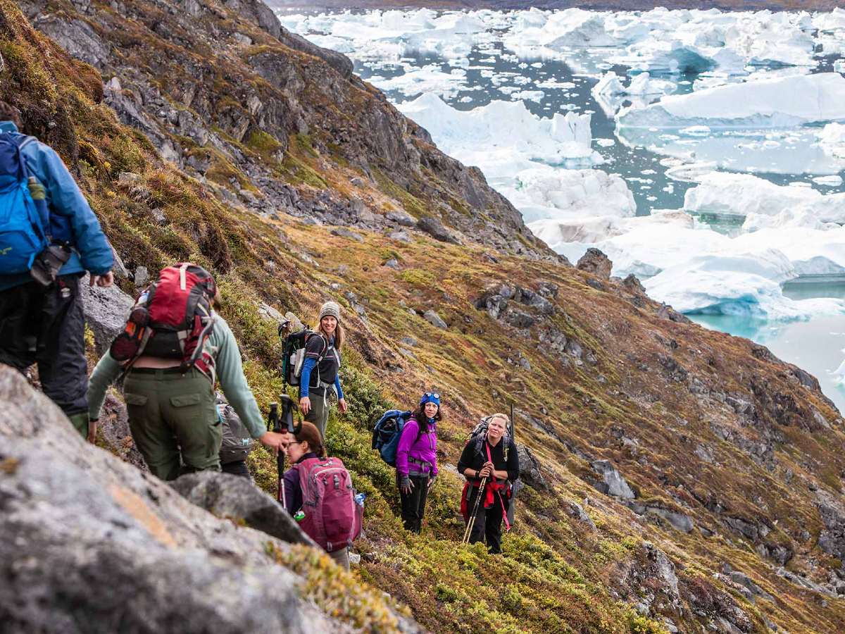 Hikers descending on guided tour in Greenland and Iceland