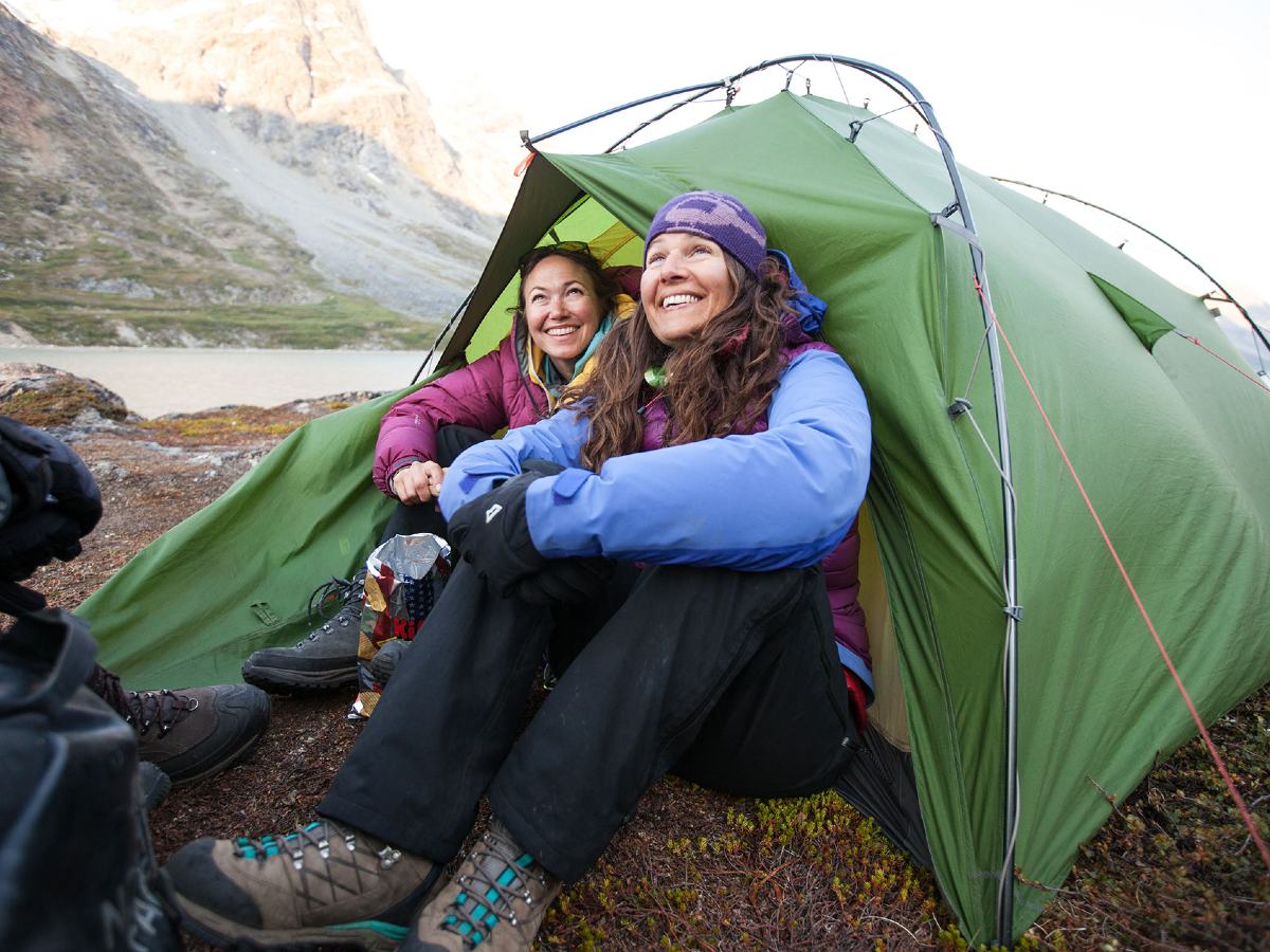 Two hikers enjoying a sunny morning on guided tour to Greenland