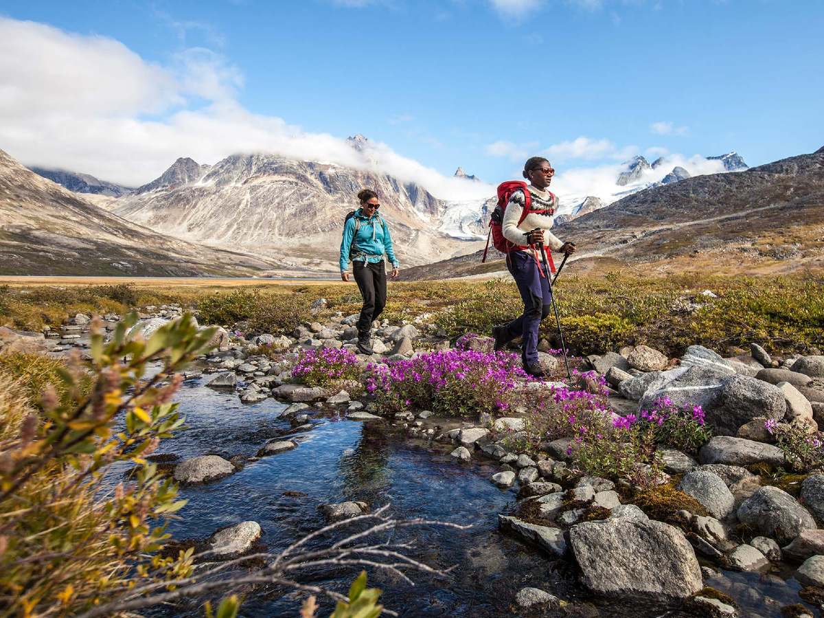 Two hikers in stunning surroundings of Greenland